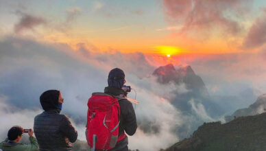 Hikers watching sunrise above the clouds at Doi Luang Chiang Dao in Chiang Mai, Thailand